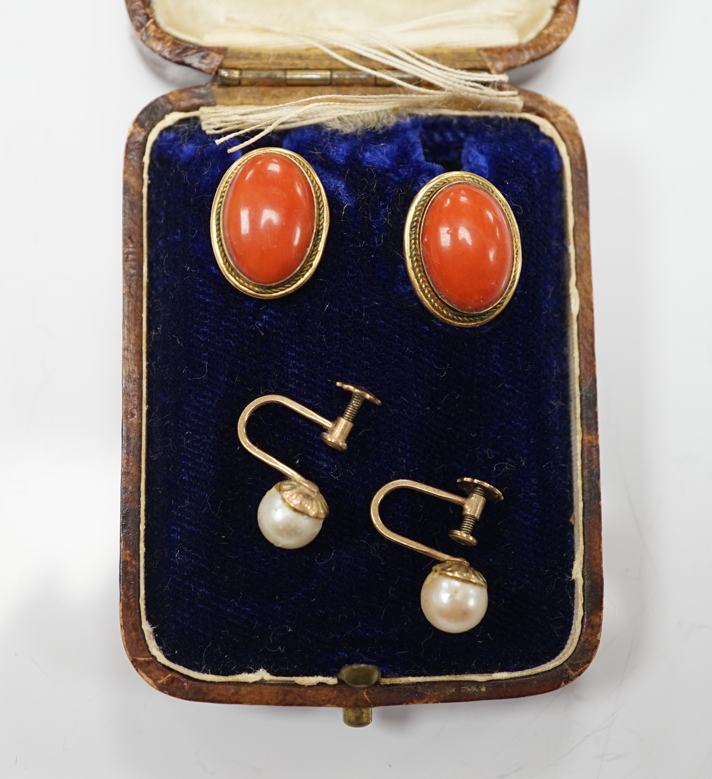 A pair of 750 yellow metal and cabochon coral set ear clips, 16mm and a pair of 9ct and single stone cultured pearl set ear clips.